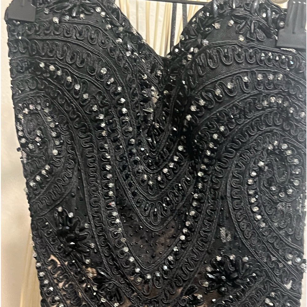 Beautiful beaded gown with nude lining drape bottom.Black w/nude lining